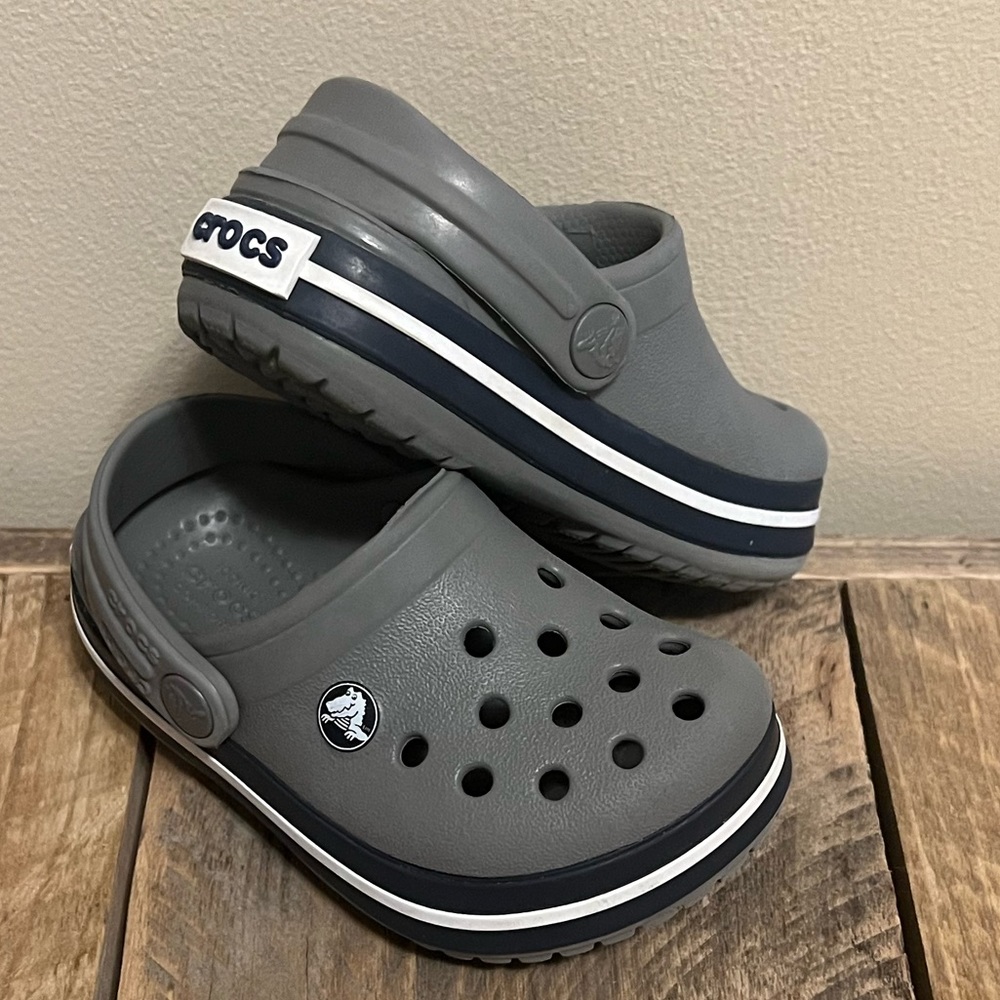 Crocs for baby/toddler. Size C5. Grey with white and navy stripe. EUC.